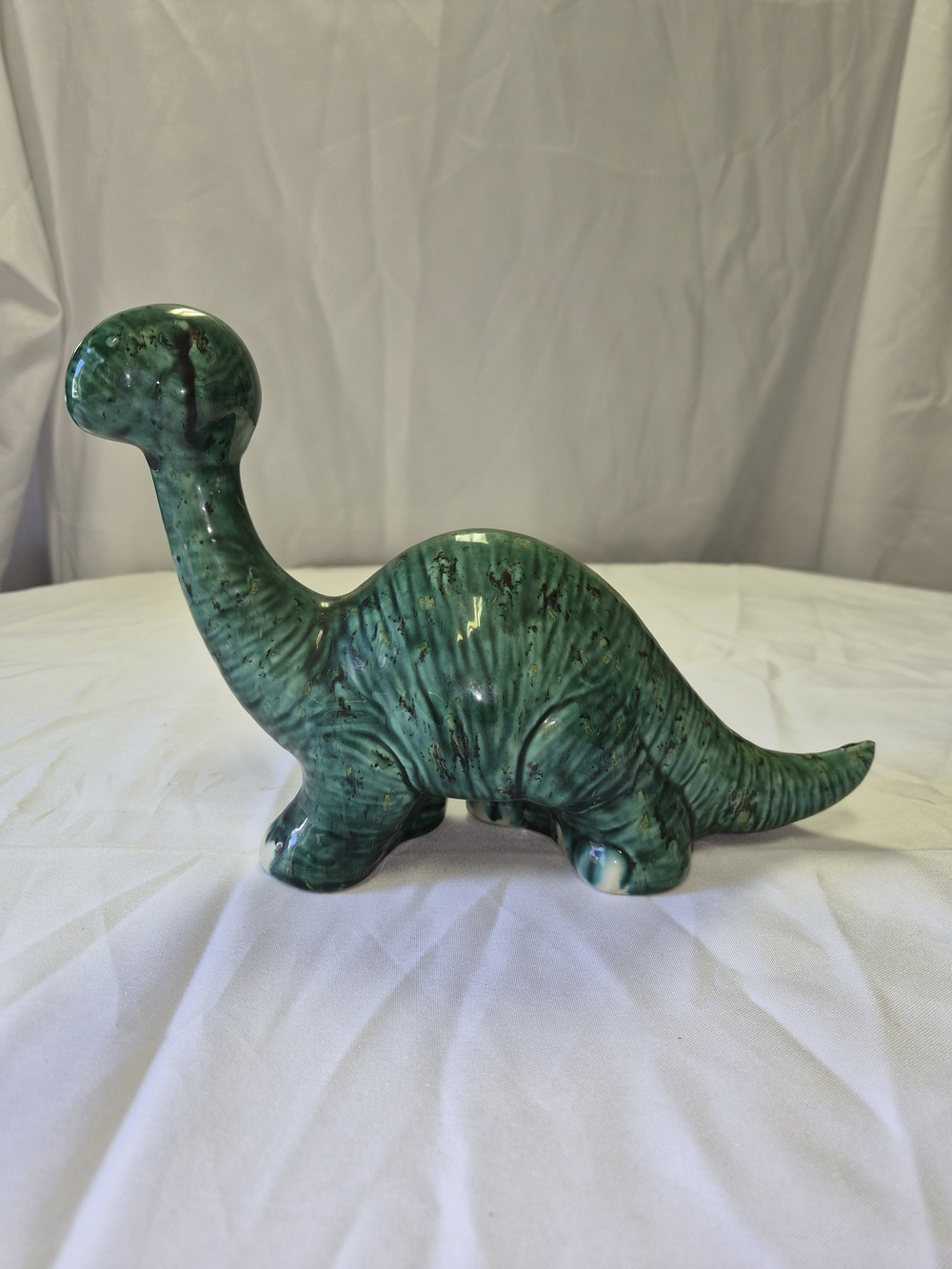 Vintage-style ceramic long-necked sauropod